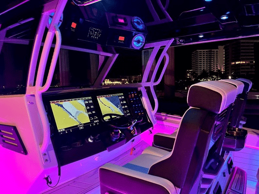 The interior of the Blackfin Boats 400CC is lit up with purple lights